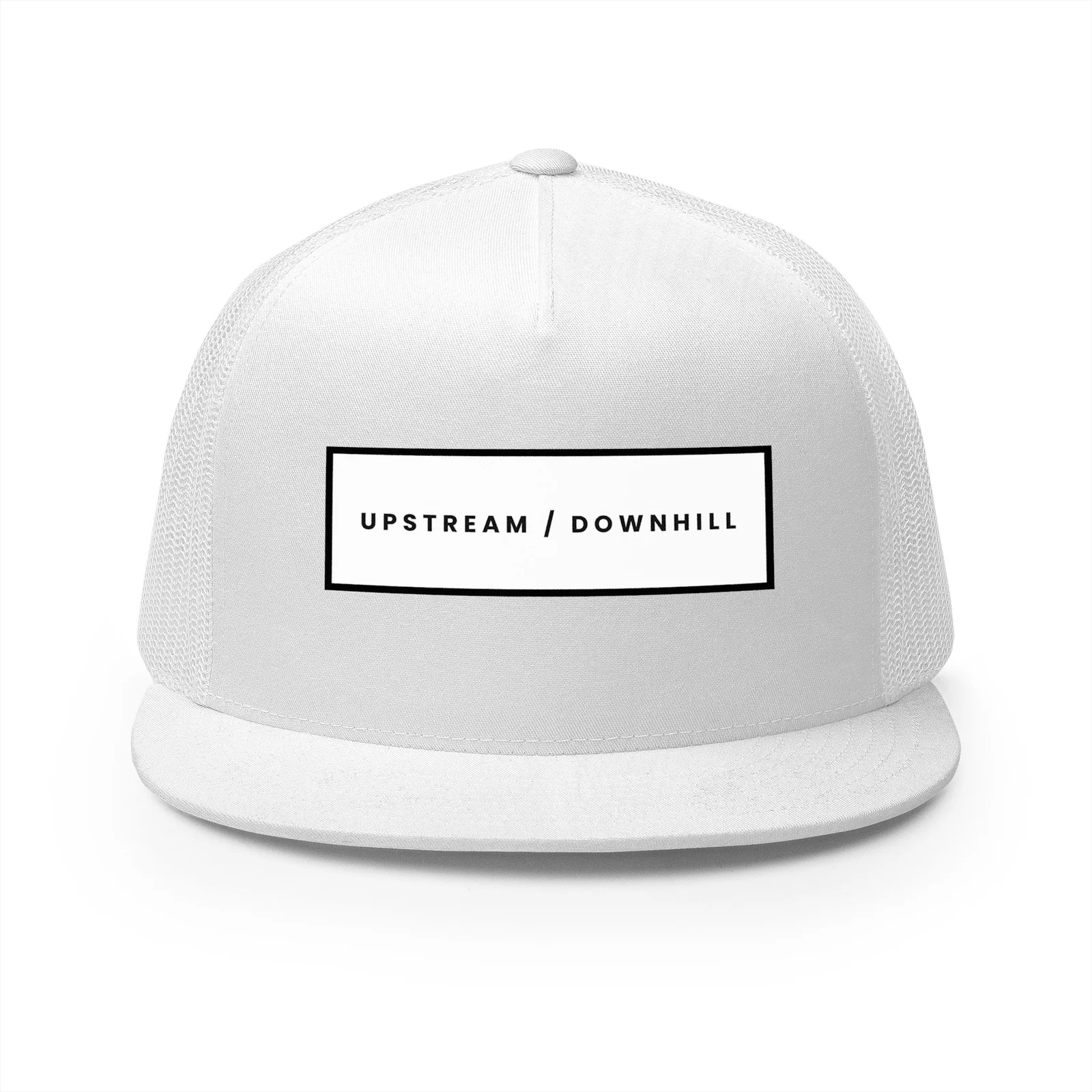 White trucker hat with a black Upstream / Downhill wordmark patch on the front