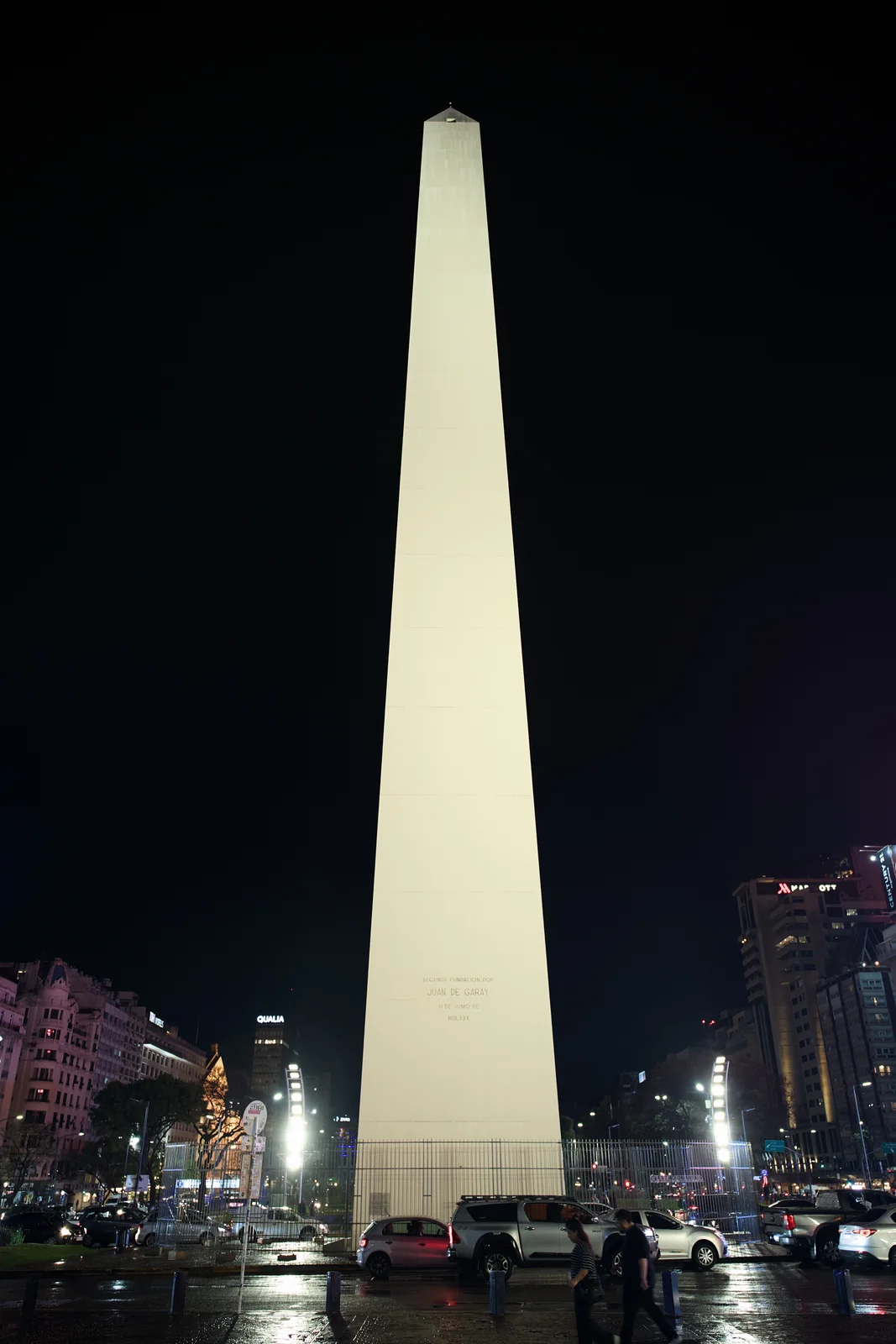 The illuminated Obelisco de Buenos Aires towering against a black night sky