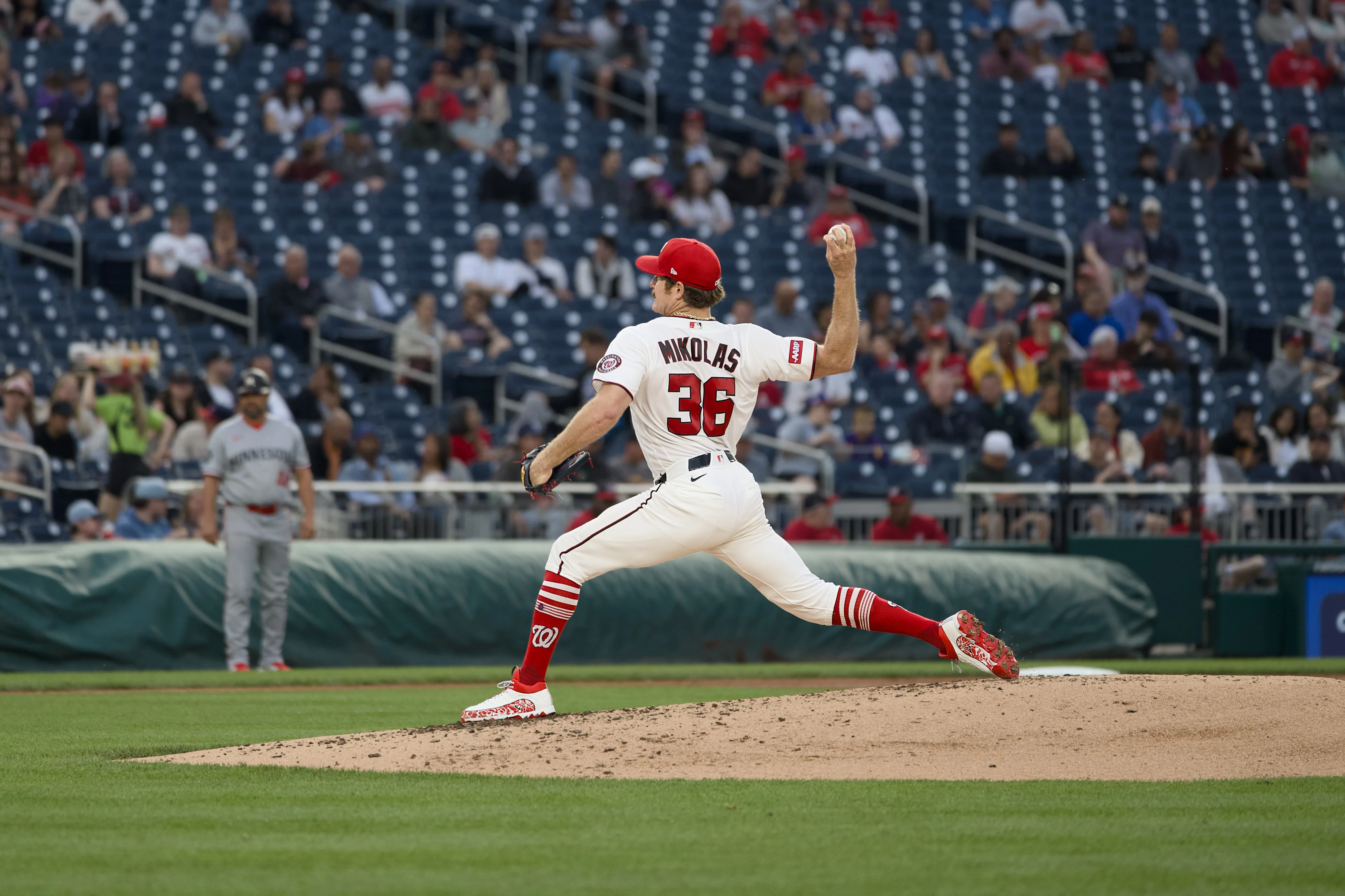 Nationals pitcher Mikolas #36 in a full wind-up delivery on the mound at Nationals Park